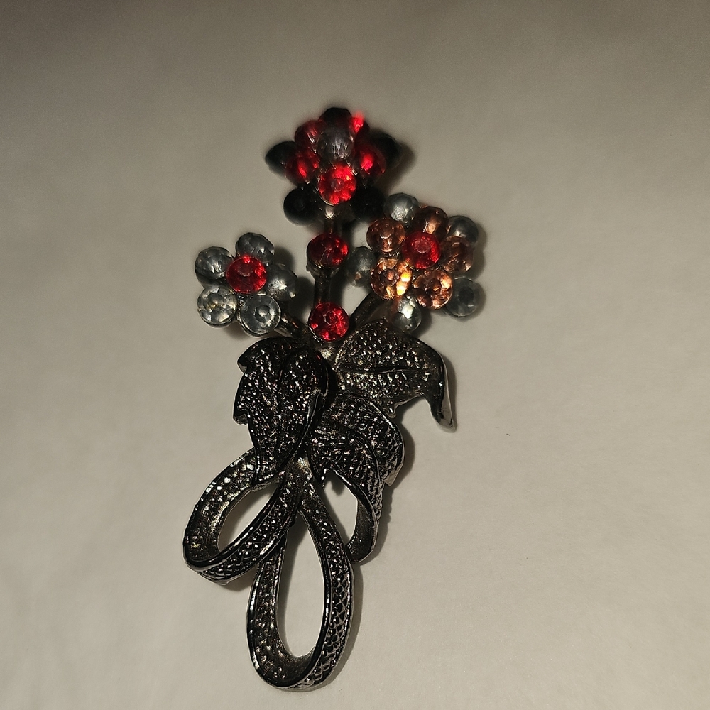 Elegant Floral Brooch with Red and Silver Accents